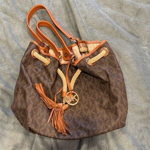 Michael Kors Brown and Tan Logo Drawstring Shoulder Bag with Tassel
